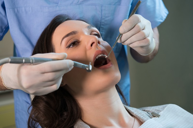 Dentist working on patient