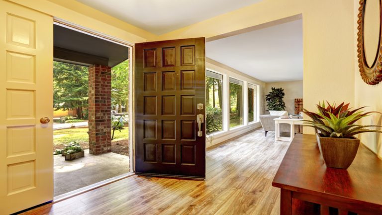 How Can a Front Door Visually Connect a Two-Story Façade With the Ground Level?