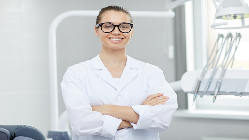 Female Dentist Posing in Office