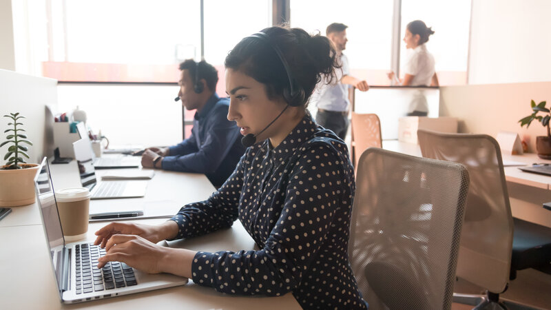 Indian woman call center operator working in customer service office