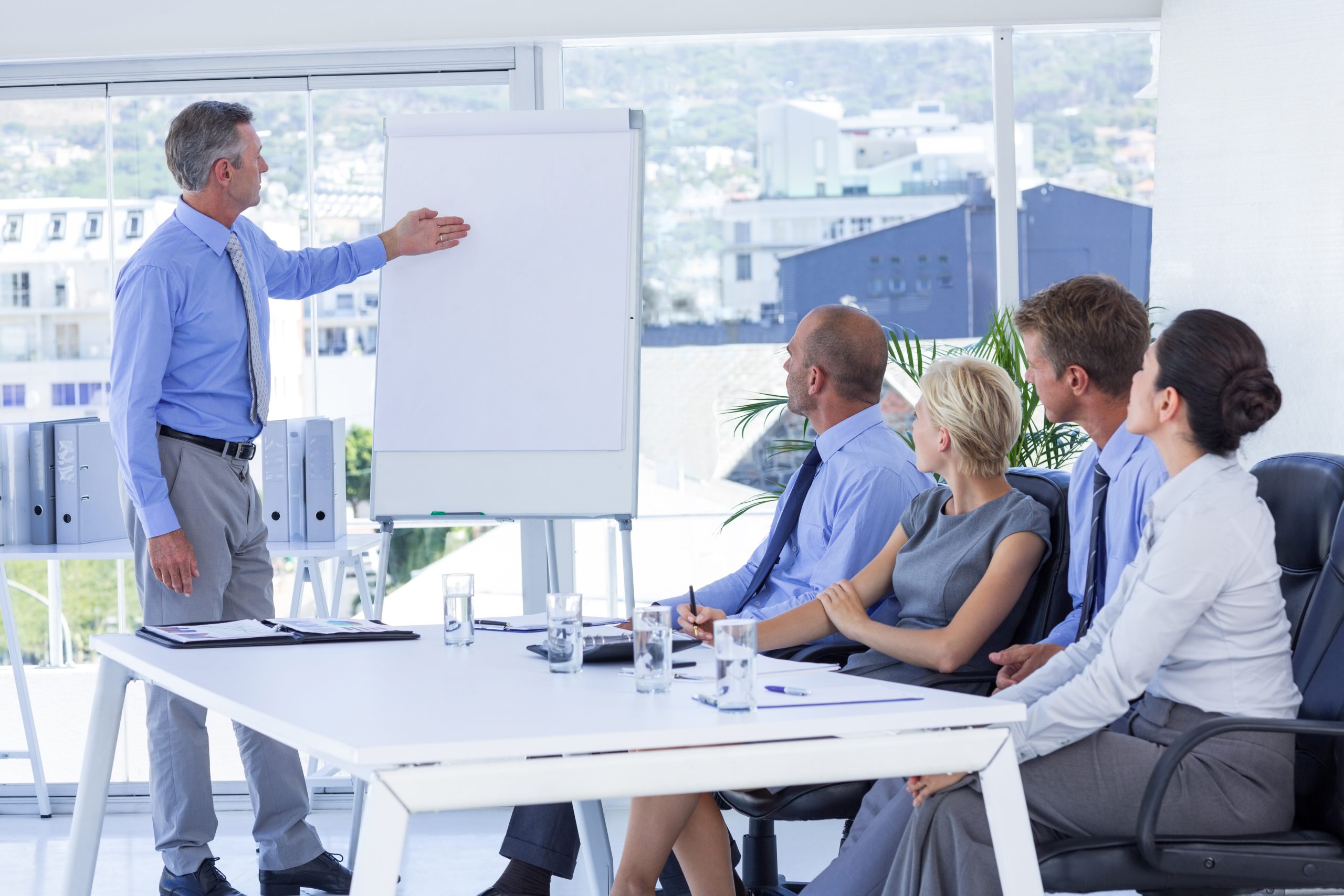 Business people listening during meeting in office